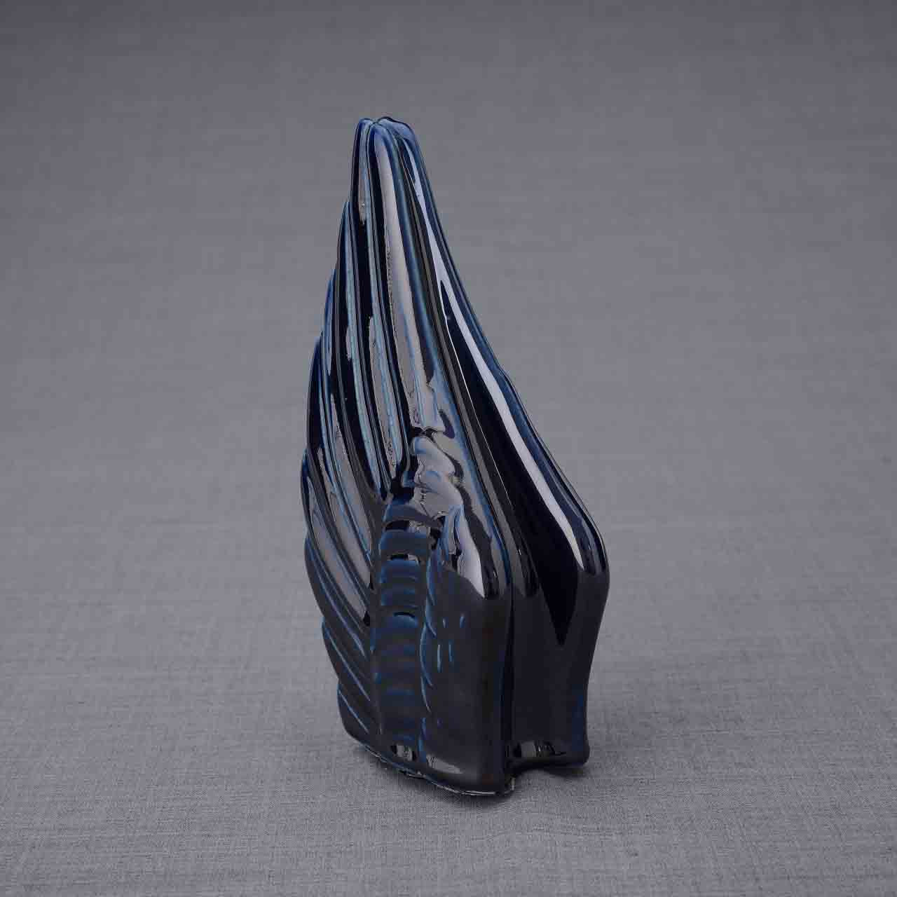 Wings Ashes Keepsake Urn in Metallic Blue Turned Left Dark Background