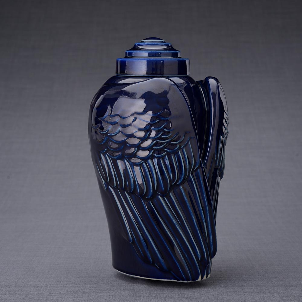 Wings Cremation Urn for Ashes in Metallic Blue Turned Right Dark Background