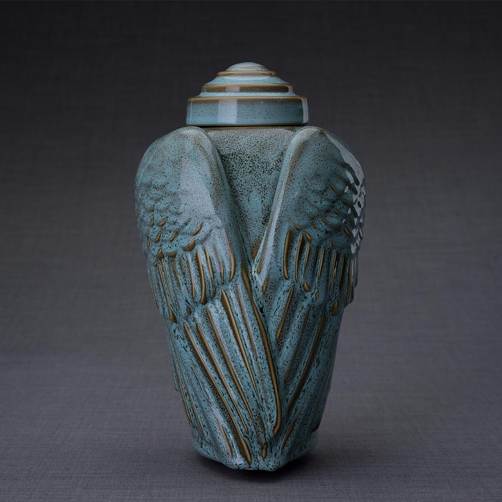 Wings Cremation Urn for Ashes in Oily Green Dark Background