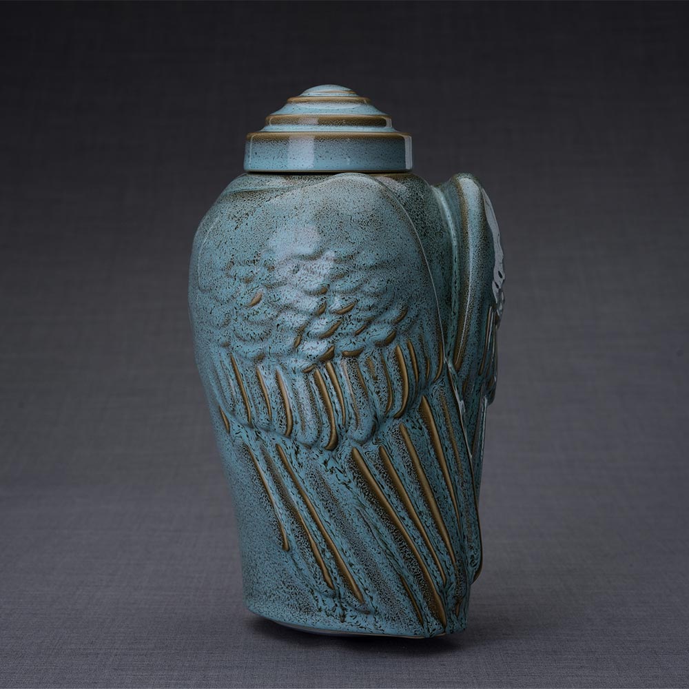Wings Cremation Urn for Ashes in Oily Green Turned Right Dark Background