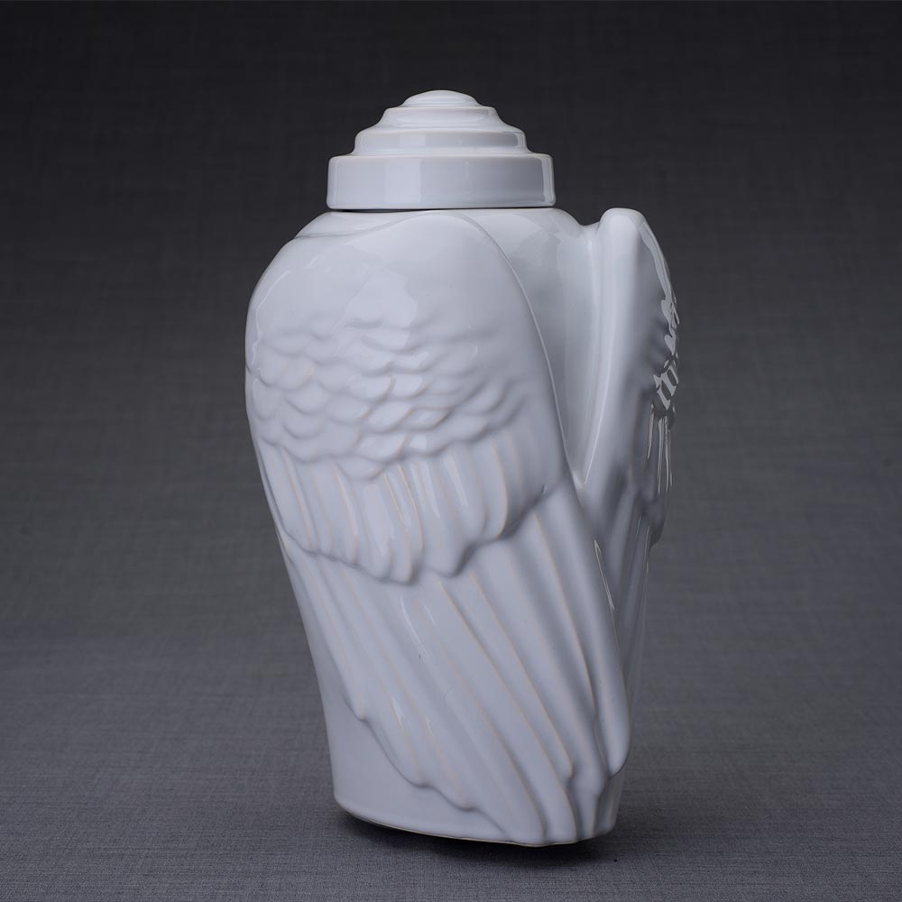 Wings Cremation Urn for Ashes in White Turned Right Dark Background