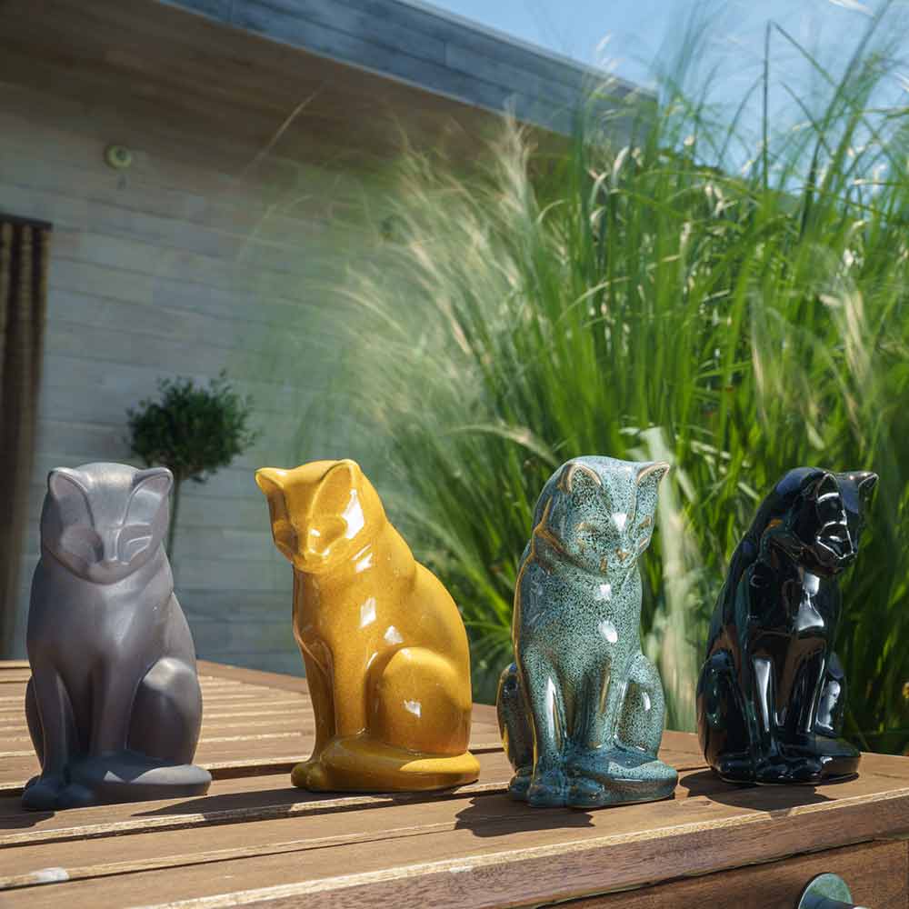 Cat Urns For Ashes Outside In Sun On Table Glossy Black
