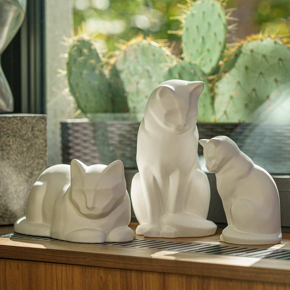 Matte White Cat Urns On Window Ledge Front Facing