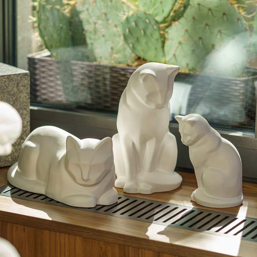 Matte White Cat Urns On Window Ledge