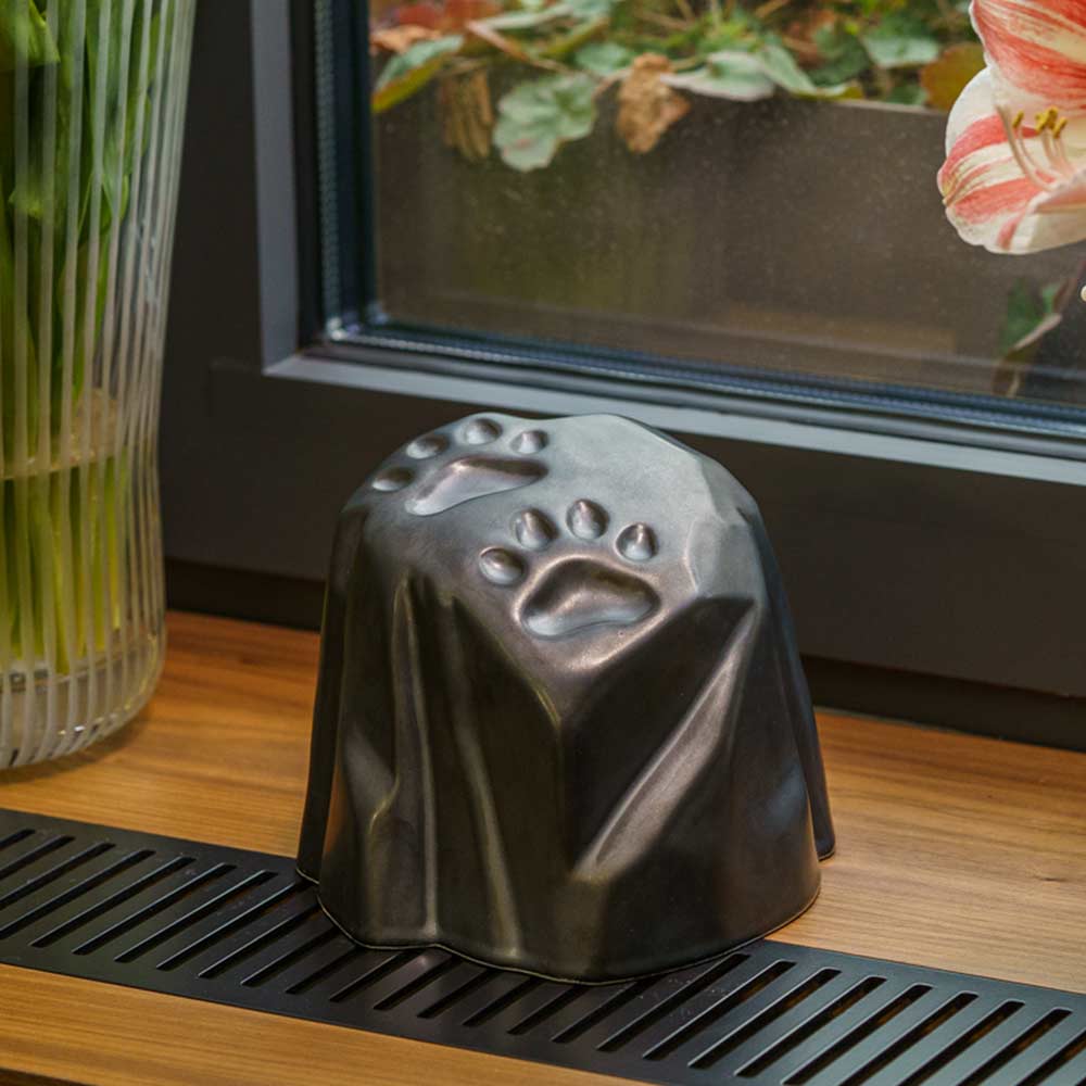 Paw Prints Dog Urn For Ashes Matte Black On Window Close Up