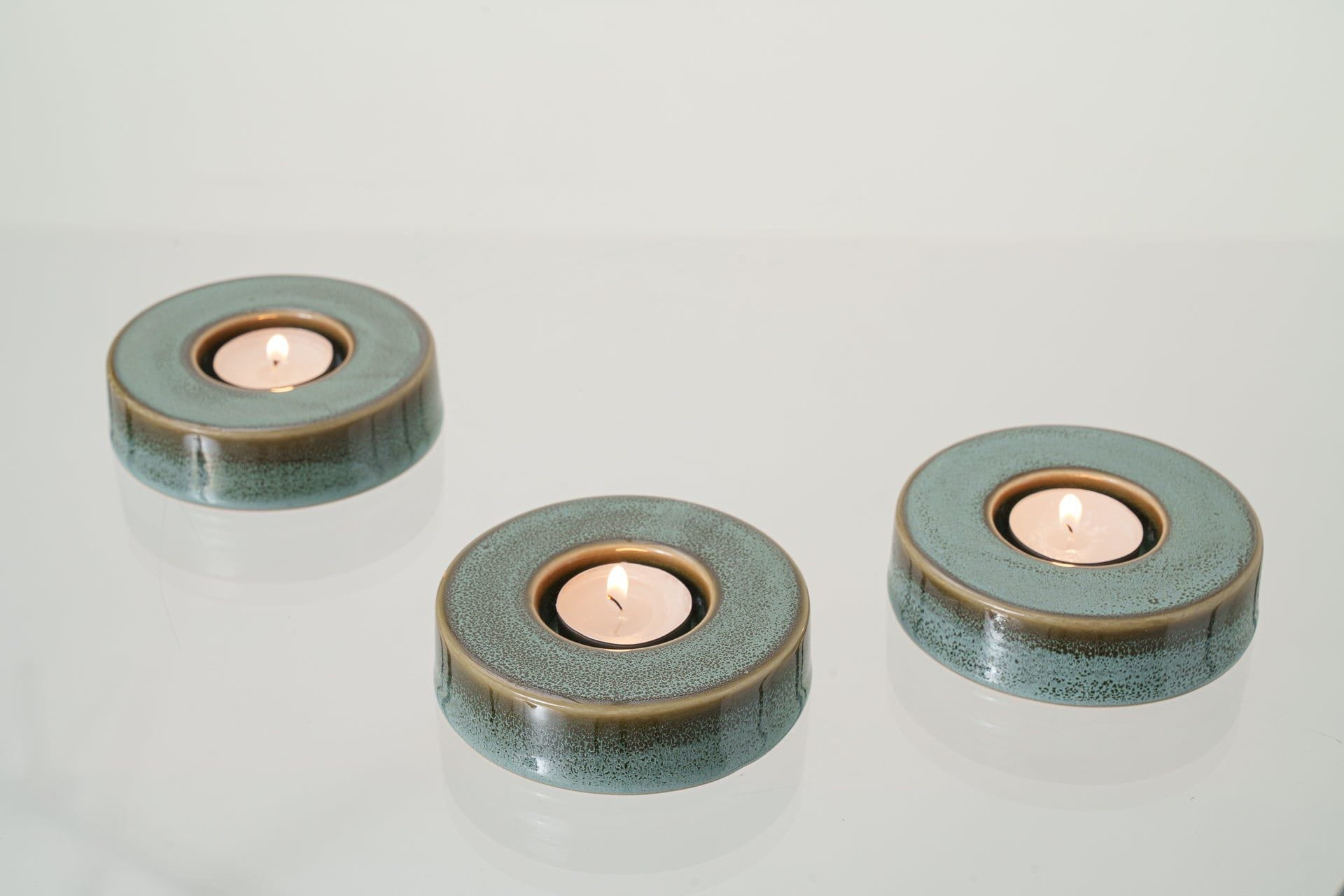 Caleo Candle Holder for Cremation Urns in Oily Green
