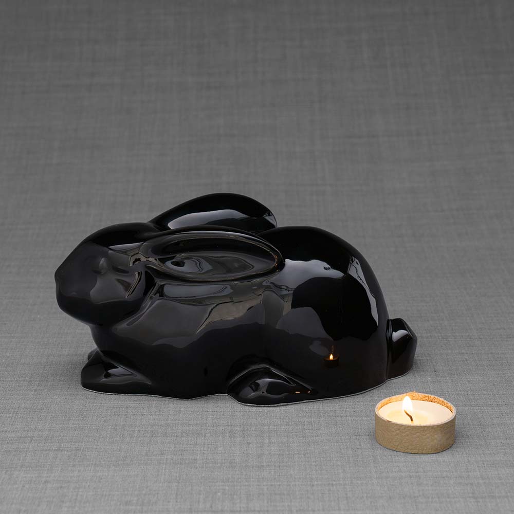 Rabbit Urn For Ashes Glossy Black Left With Candle