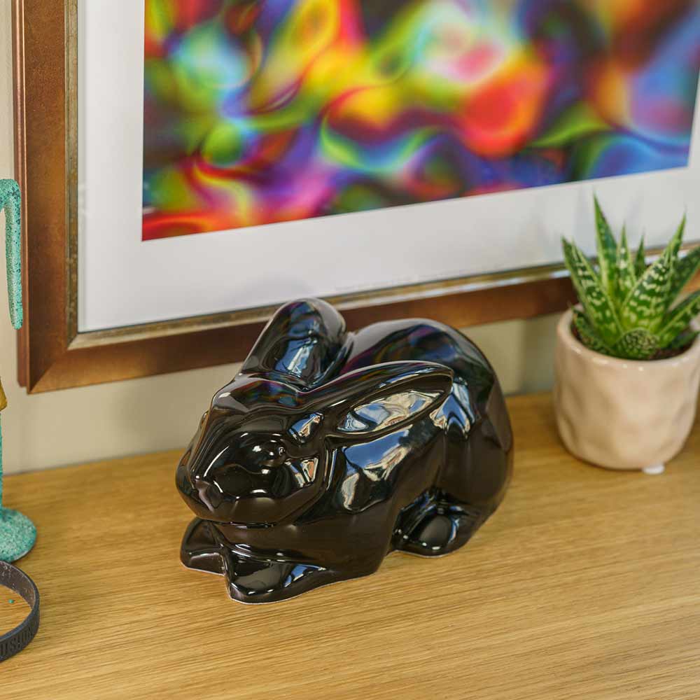 Rabbit Urn For Ashes Glossy Black On Shelf Front Left