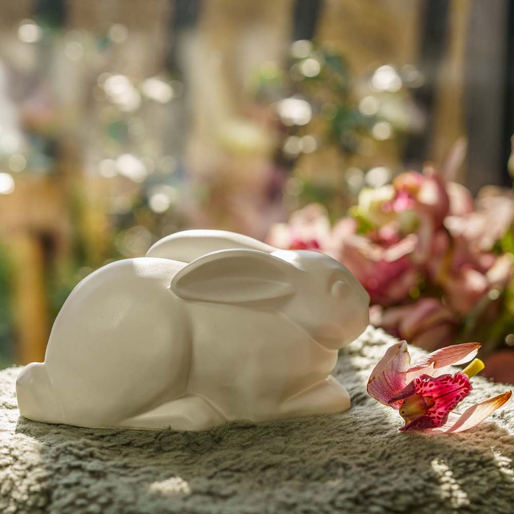 Rabbit Urn For Ashes Matte White On Cushion Back Right