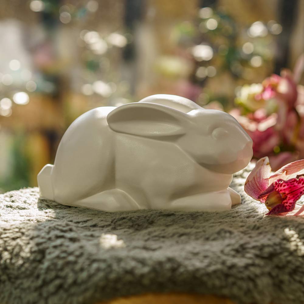 Rabbit Urn For Ashes Matte White On Cushion Right