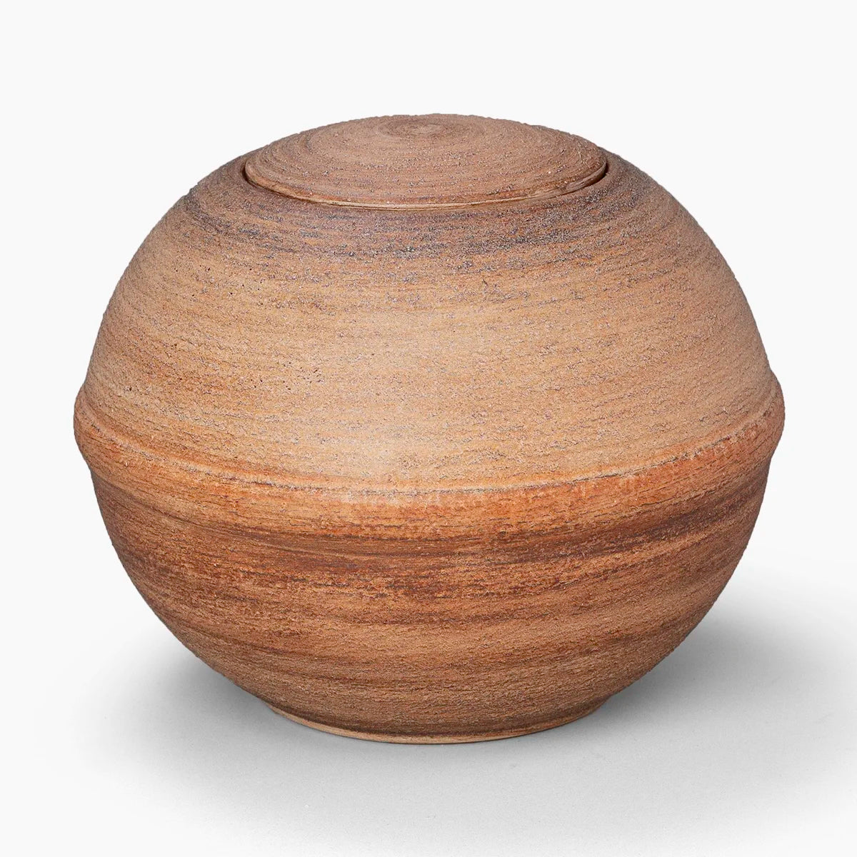 round adult biodegradable urn for ashes in terracotta earth
