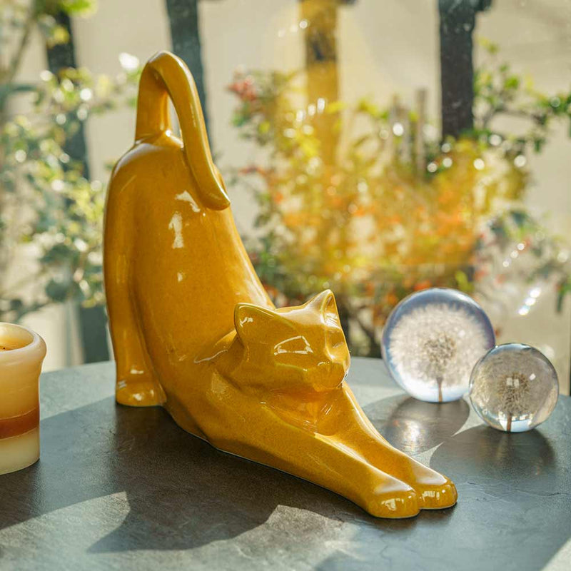Stretching Cat Urn For Ashes Amber On Table Facing Front Right