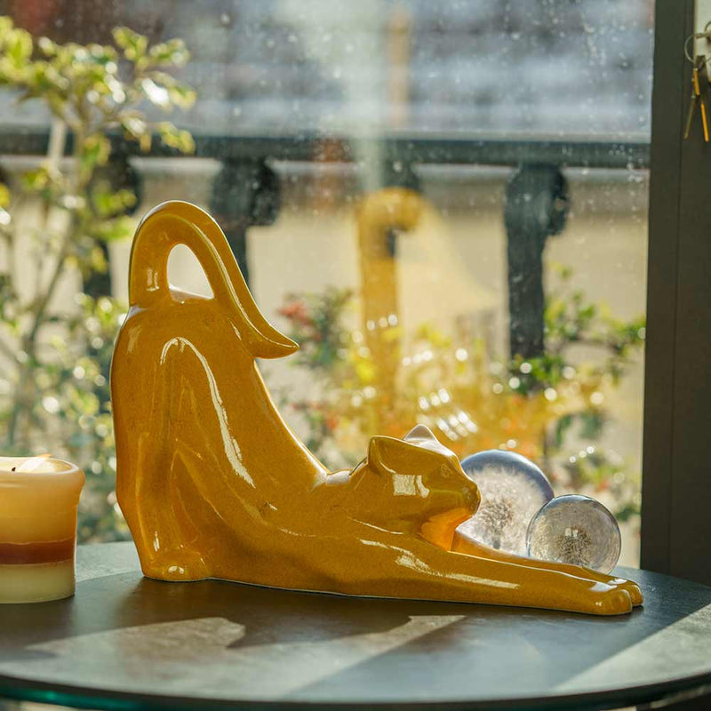 Stretching Cat Urn For Ashes Amber On Table Facing Right