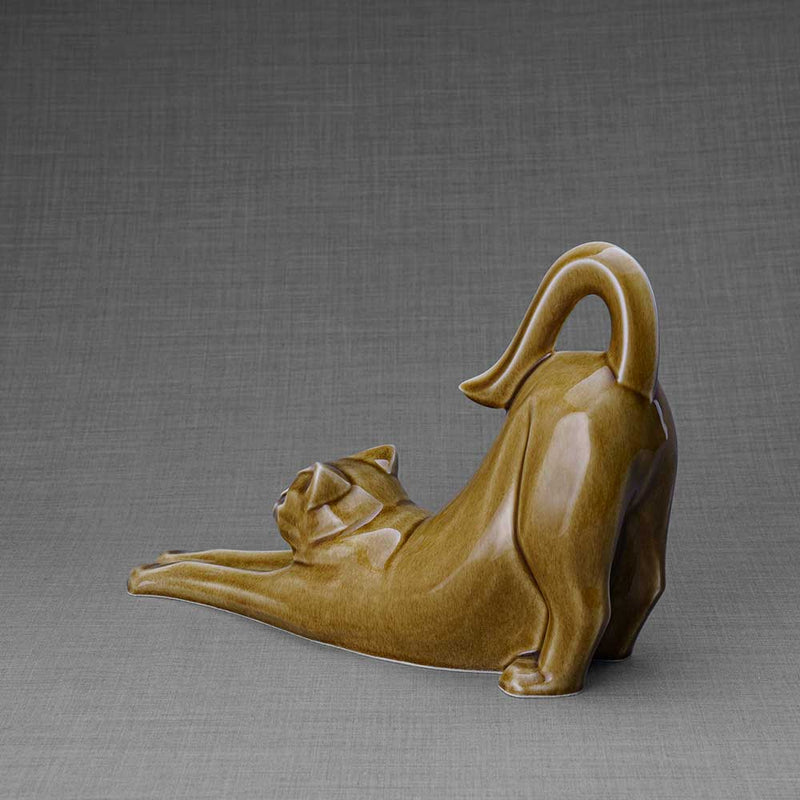 Stretching Cat Urn for Ashes in Dark Sand