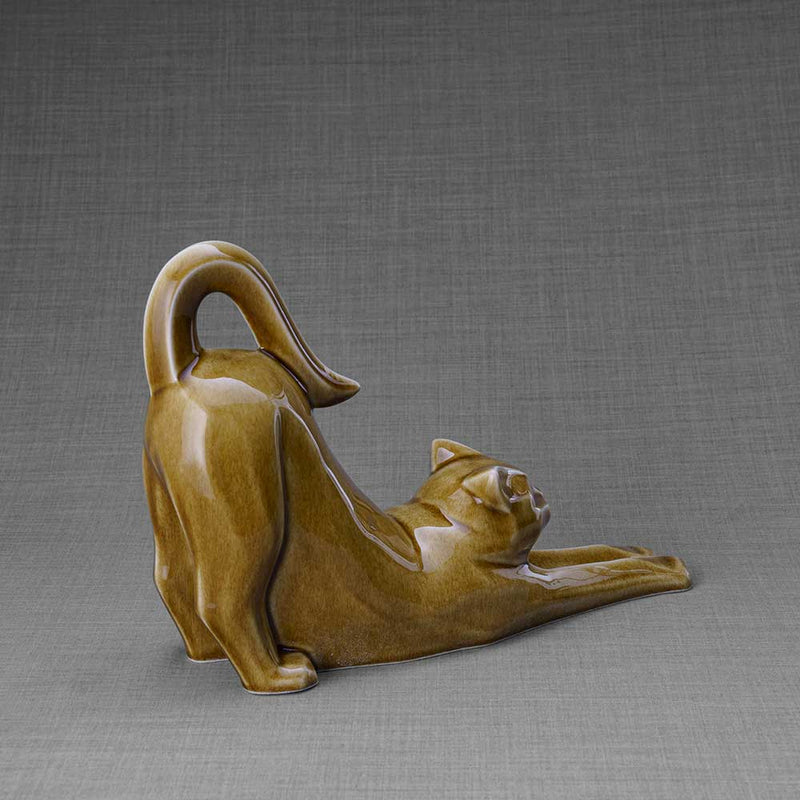 Stretching Cat Urn for Ashes in Dark Sand