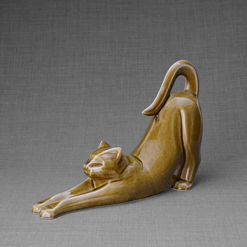 Stretching Cat Urn for Ashes in Dark Sand