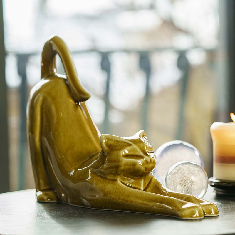 Stretching Cat Urn for Ashes in Dark Sand