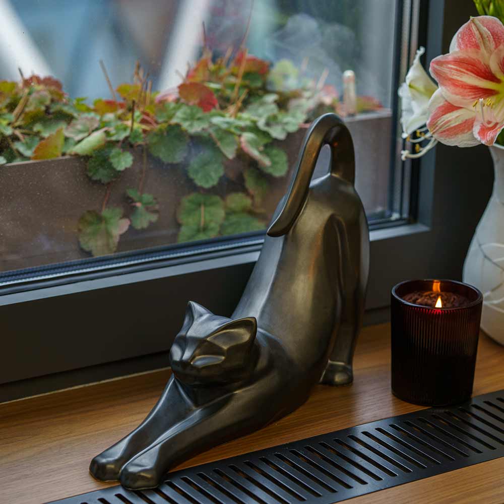 Stretching Cat Urn For Ashes Matte Black On Shelf Front Left