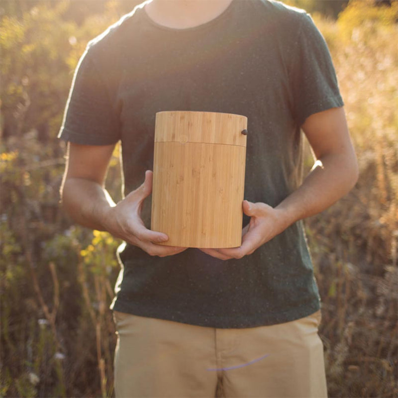 Bamboo Biodegradable Burial Urn for Pets Ashes Guy Holding