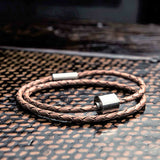 Braided Leather Ashes Bracelet for Men in Cognac on Surface