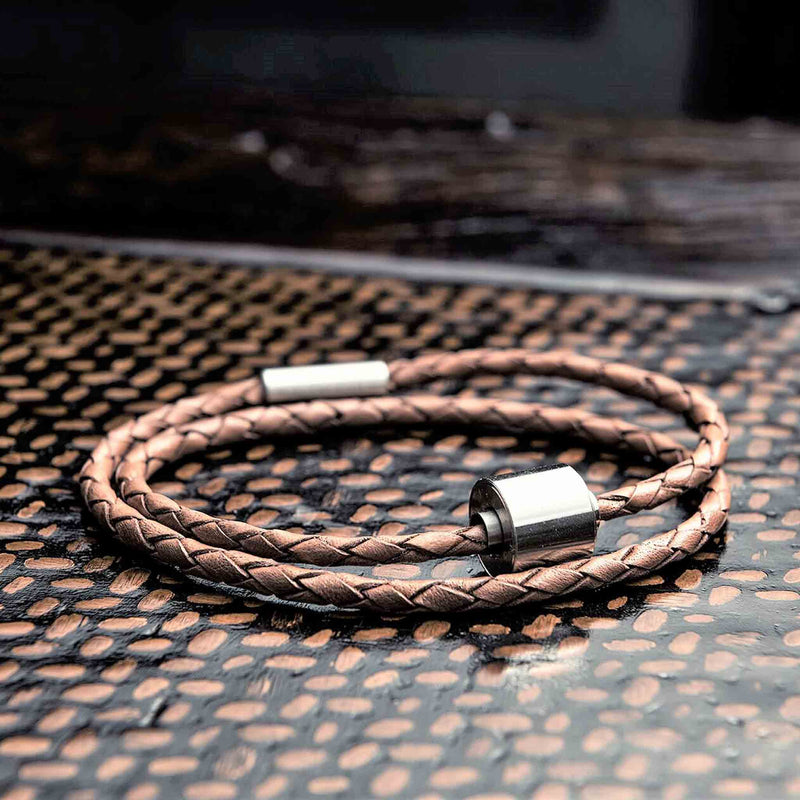 Braided Leather Ashes Bracelet for Men in Cognac on Surface