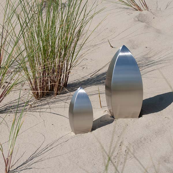 Drop Ashes Keepsake Urn in Stainless Steel in Sand