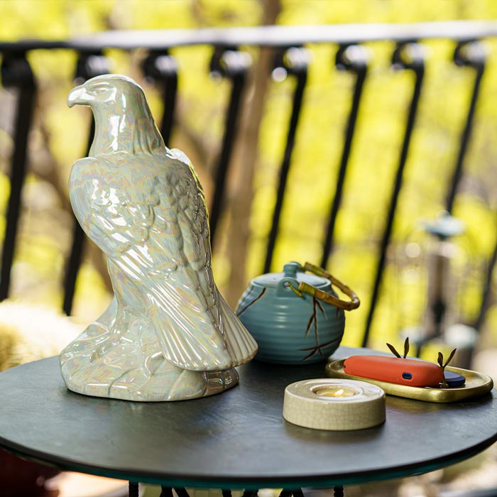 Eagle Cremation Urn for Ashes Pearlescent White on Table Outside