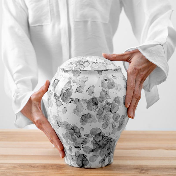 Freckled Classic Cremation Urn for Ashes White Being Held