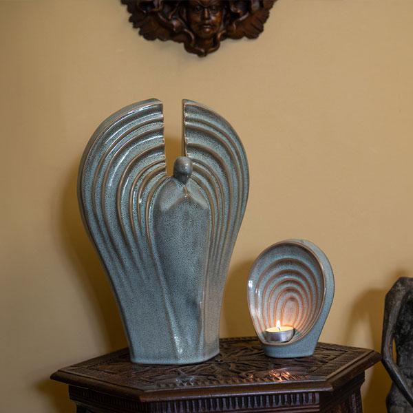 Guardian Angel Cremation Urn and Ashes Keepsake Urn Matching Set Oily Green on table