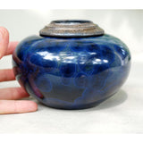 Indigo Cremation Urn for Pets Ashes Close up with Hand