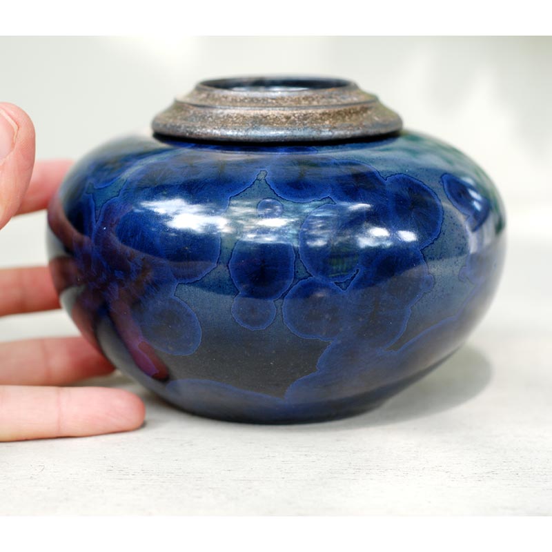 Indigo Cremation Urn for Pets Ashes Close up with Hand