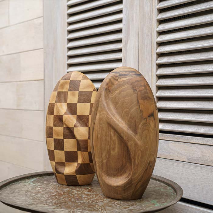 Infinity Wooden Adult Urn for Ashes Chequered and Walnut on Table by Wall