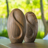 Infinity Wooden Adult Urn for Ashes Walnut Wood Two on Shelf in Garden