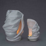 Light Cremation Urn and Ashes Keepsake Urn in White Turned Right Dark Background
