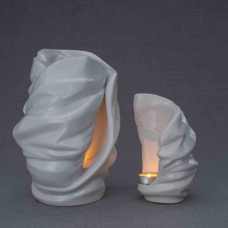 Light Cremation Urn and Ashes Keepsake Urn in White Turned Right Dark Background