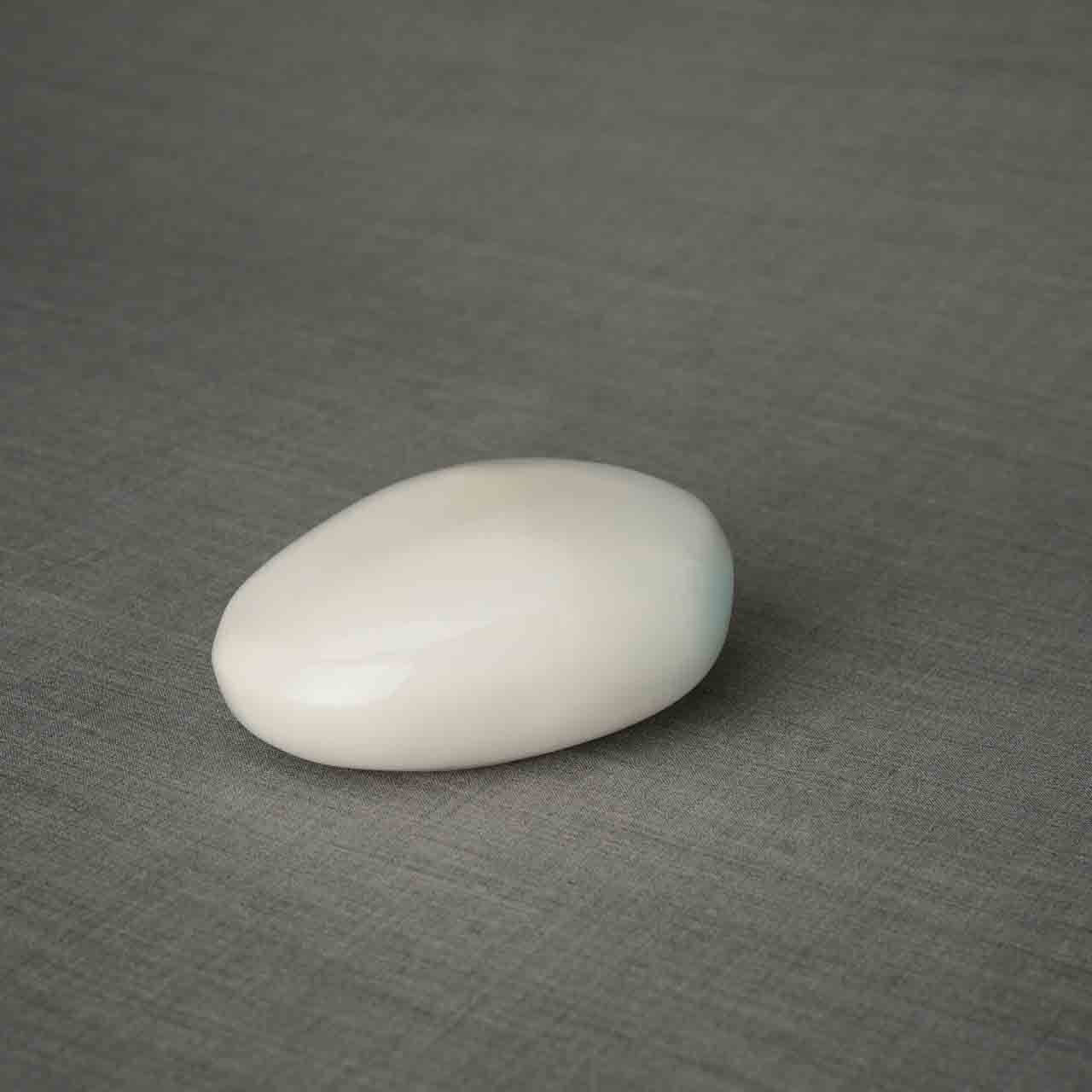 Pebbles Ashes Keepsake Urn in White Dark Background