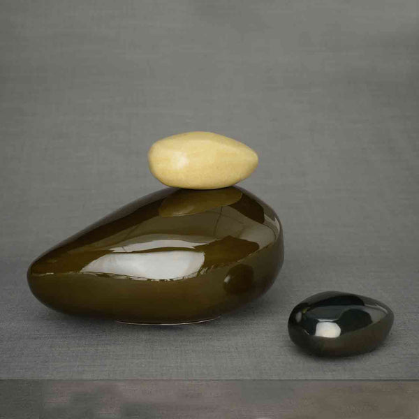 Pebbles Cremation Urn and Ashes Keepsake Urn in Brown and Glossy Black Dark Background