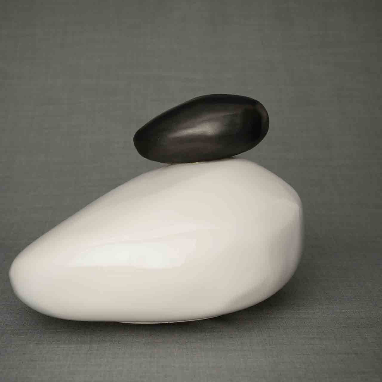 Pebbles Cremation Urn for Ashes in White and Matte Black Dark Background