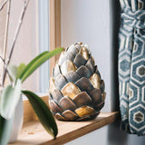 Pine Cone Cremation Urn for Ashes Painted Gold by Window