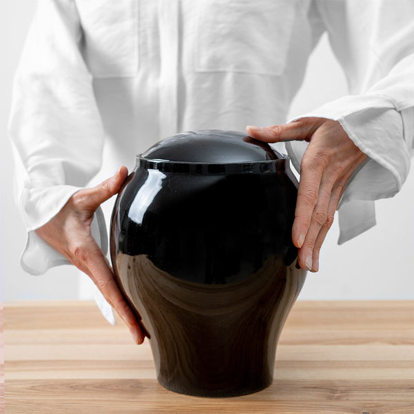 Pure Black Classic Cremation Urn for Ashes Being Held
