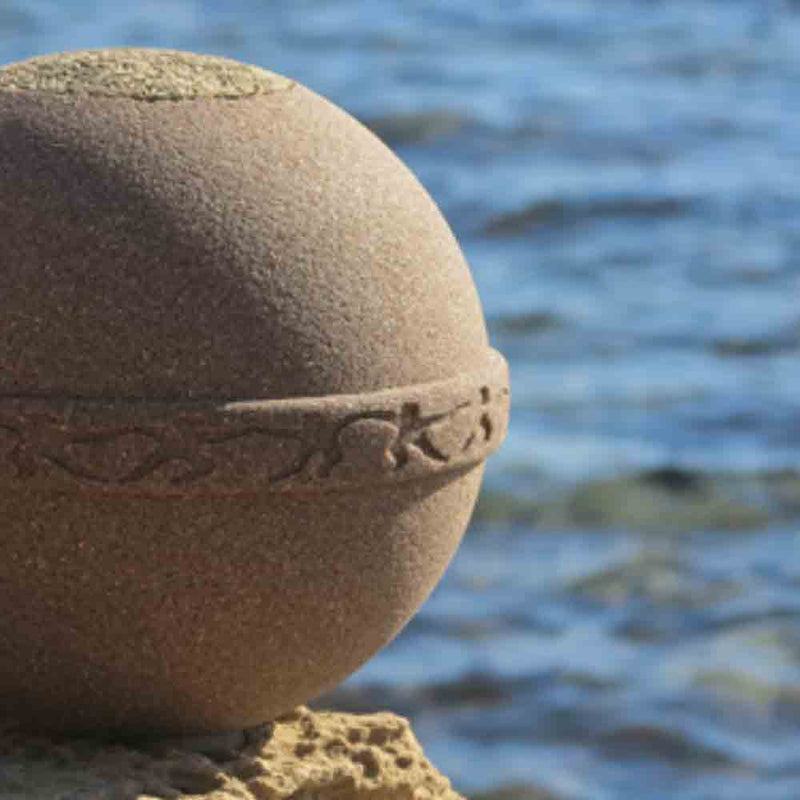 SandSphere Biodegradable Urn for Ashes Adult on Cliff Zoomed In