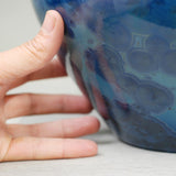 Sapphire Cremation Urn for Ashes Close Up with Hand