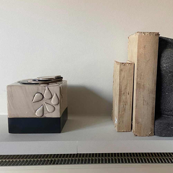 Teardrop Cube Ashes Keepsake Next to Decor