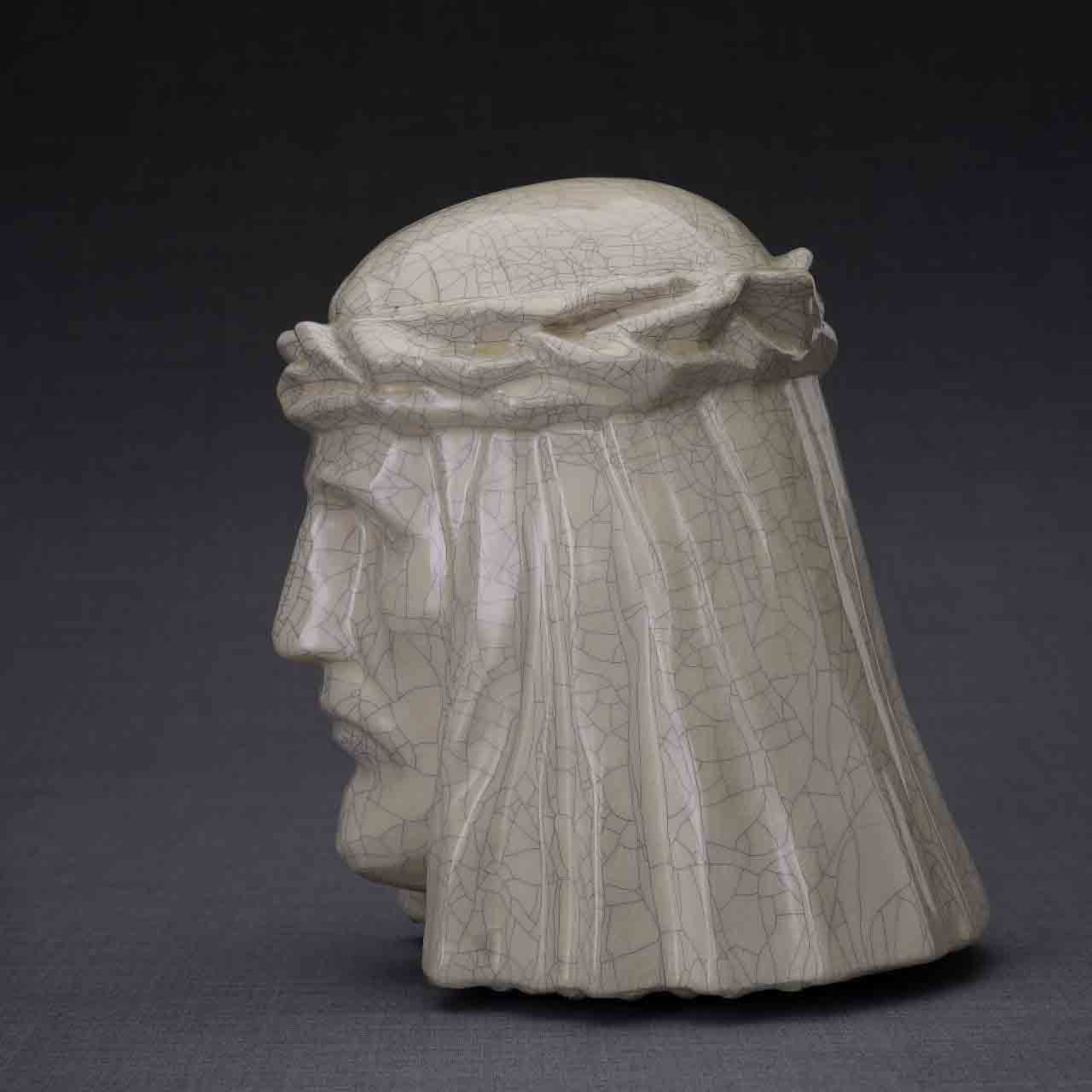 The Christ Cremation Urn for Ashes in Crackle Glaze Facing Left Dark Background