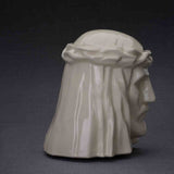The Christ Cremation Urn for Ashes in Cream Facing Right Dark Background