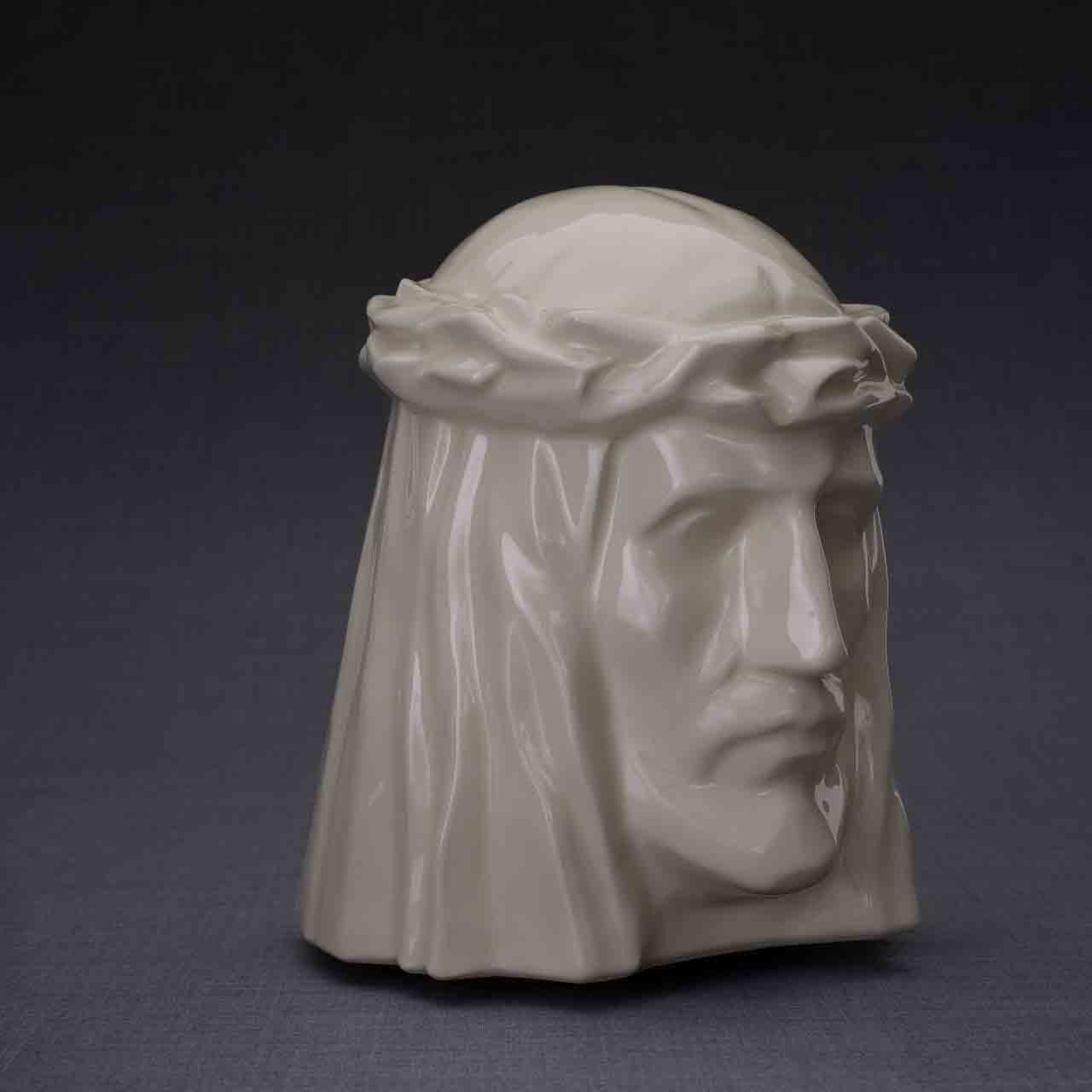 The Christ Cremation Urn for Ashes in Cream Turned Right Dark Background