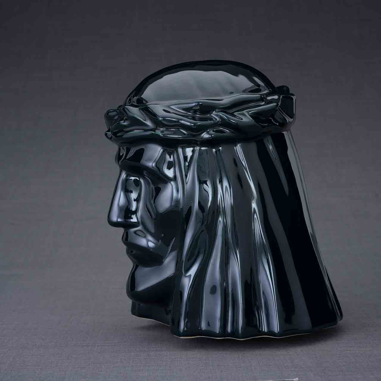 The Christ Cremation Urn for Ashes in Dark Green Facing Left Dark Background