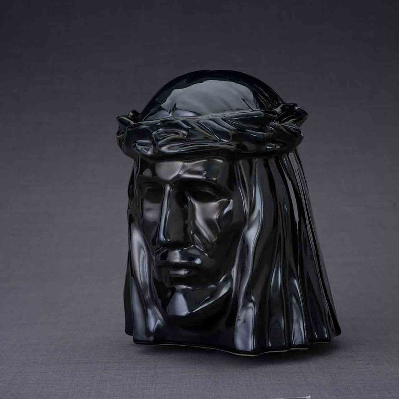 The Christ Cremation Urn for Ashes in Glossy Black Turned Left Dark Background