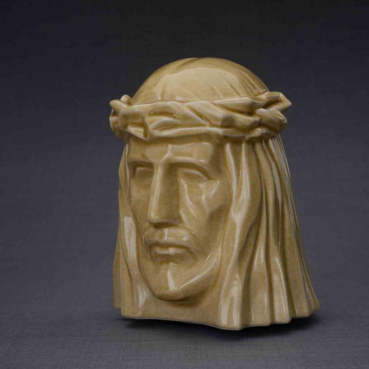 The Christ Cremation Urn for Ashes in Light Sand Turned Left Dark Background