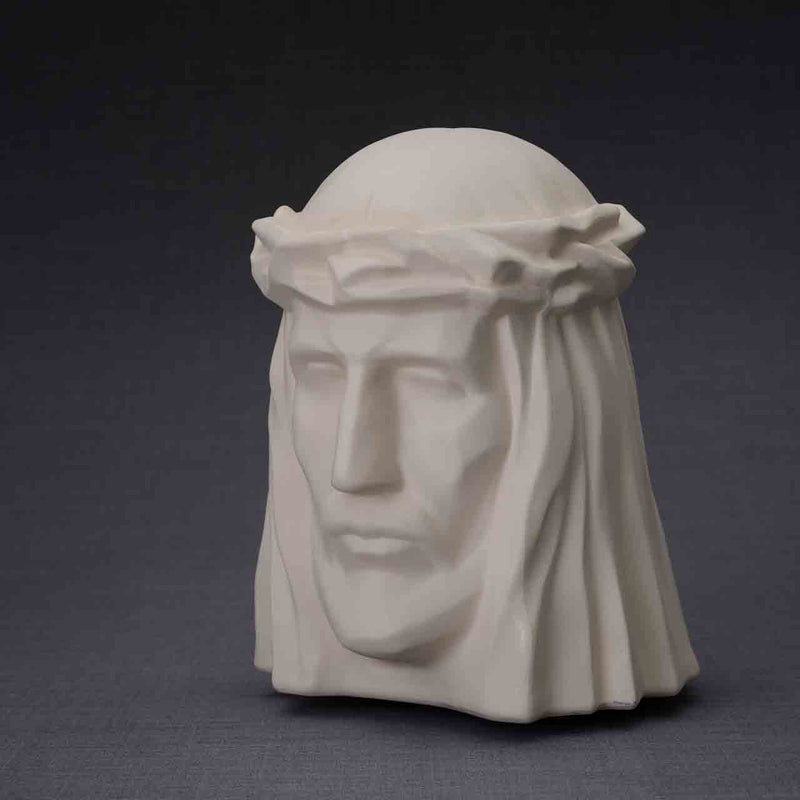 The Christ Cremation Urn for Ashes in Matte White Turned Left Dark Background
